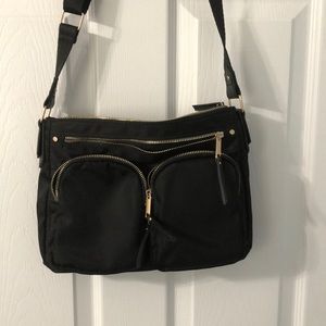Black shoulder bag with several compartments